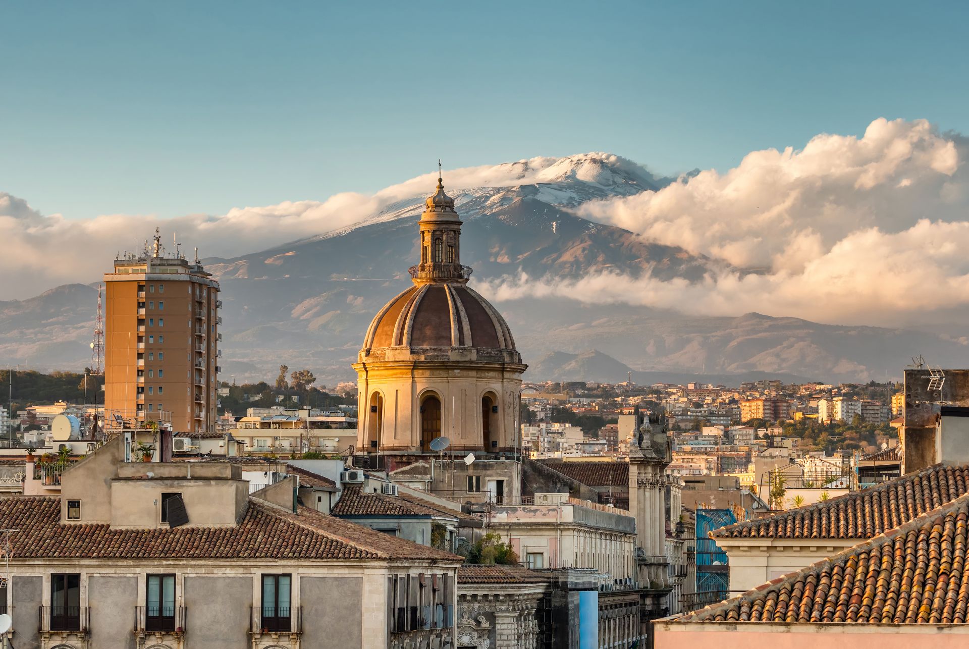 Catania-cityscape-with-the-view-of-Etna-volcano-at-sunset-in-Sicily-Italy
