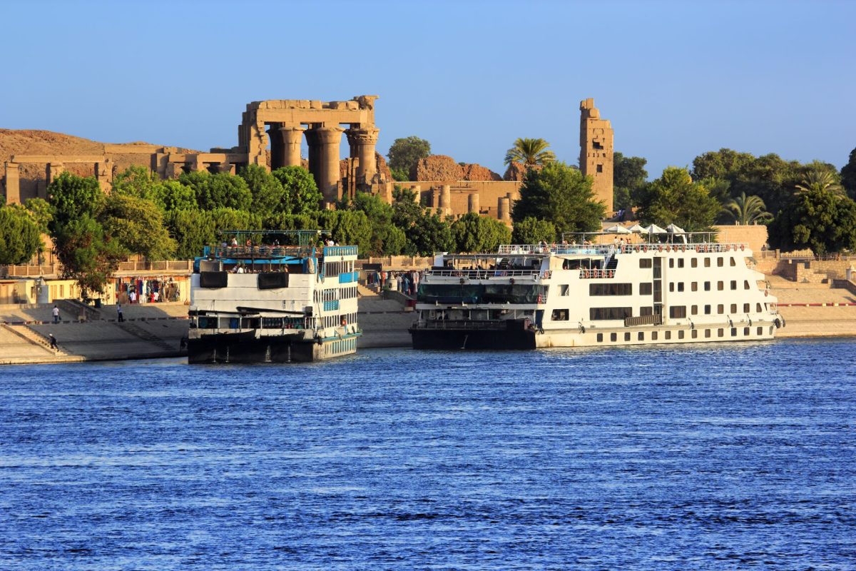 EGYPT Cruise ships at Kom Ombo, Nile. Temple of Sobek and Haroeris in background
