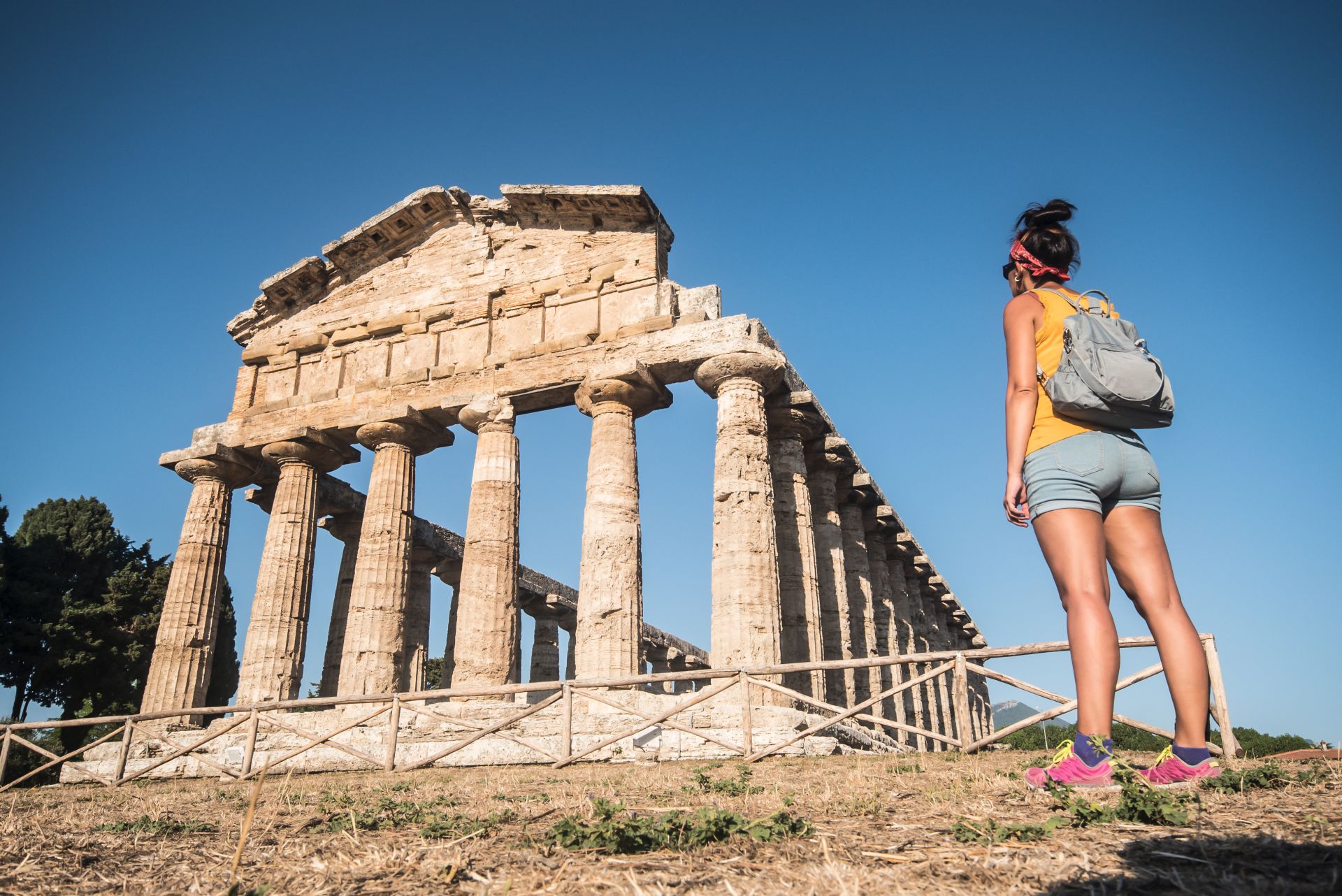 Woman-contemplating-a-temple-at-the-greco-roman-archaeological-site-of-Paestum-Italy