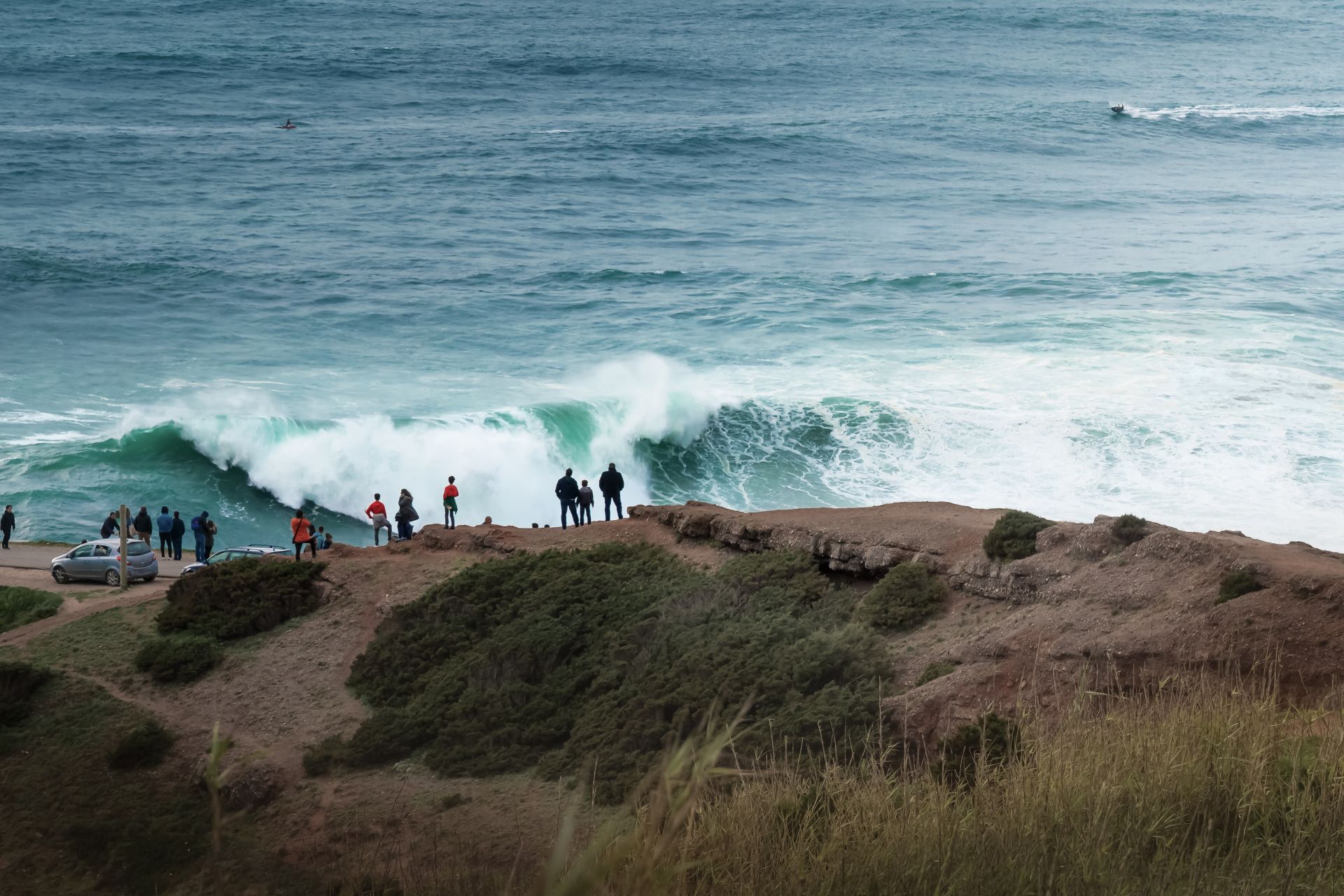 People Watching the Big Waves in Nazare - Nazare, Portugal