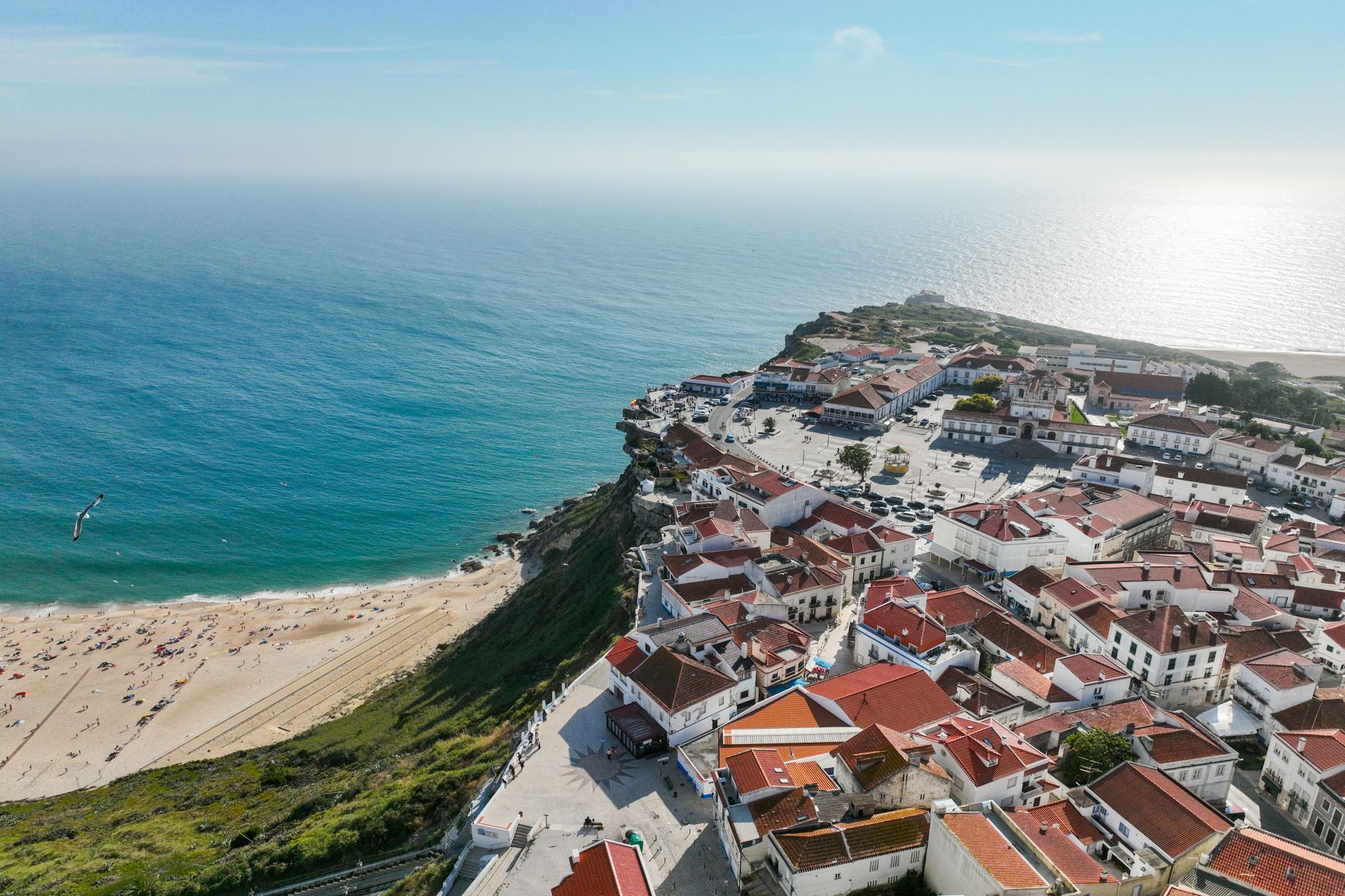 Praia da Nazare and clifftop village aerial