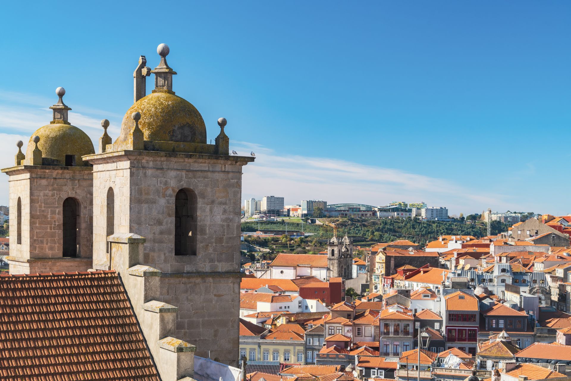 Portugal, Porto, Towers of Dos Grilos church and old town rooftops
